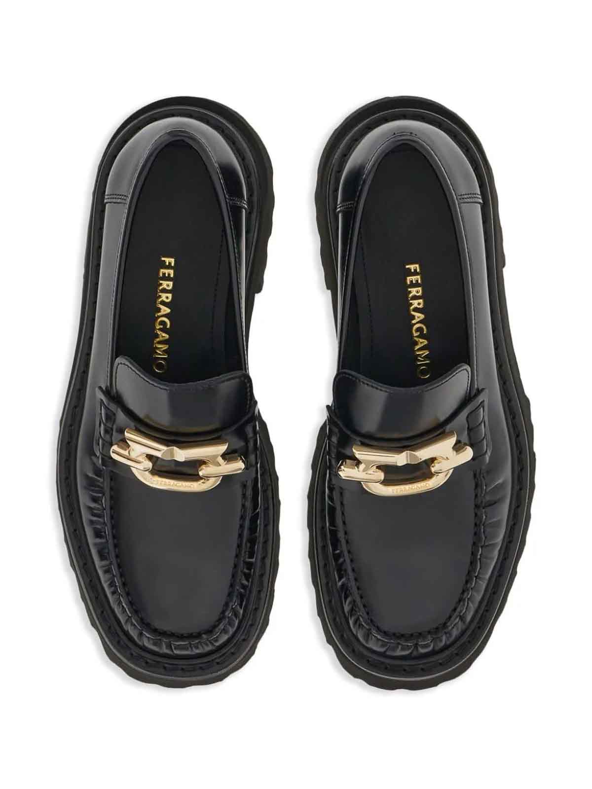 Shop Ferragamo Gancini-plaque Loafers In Black