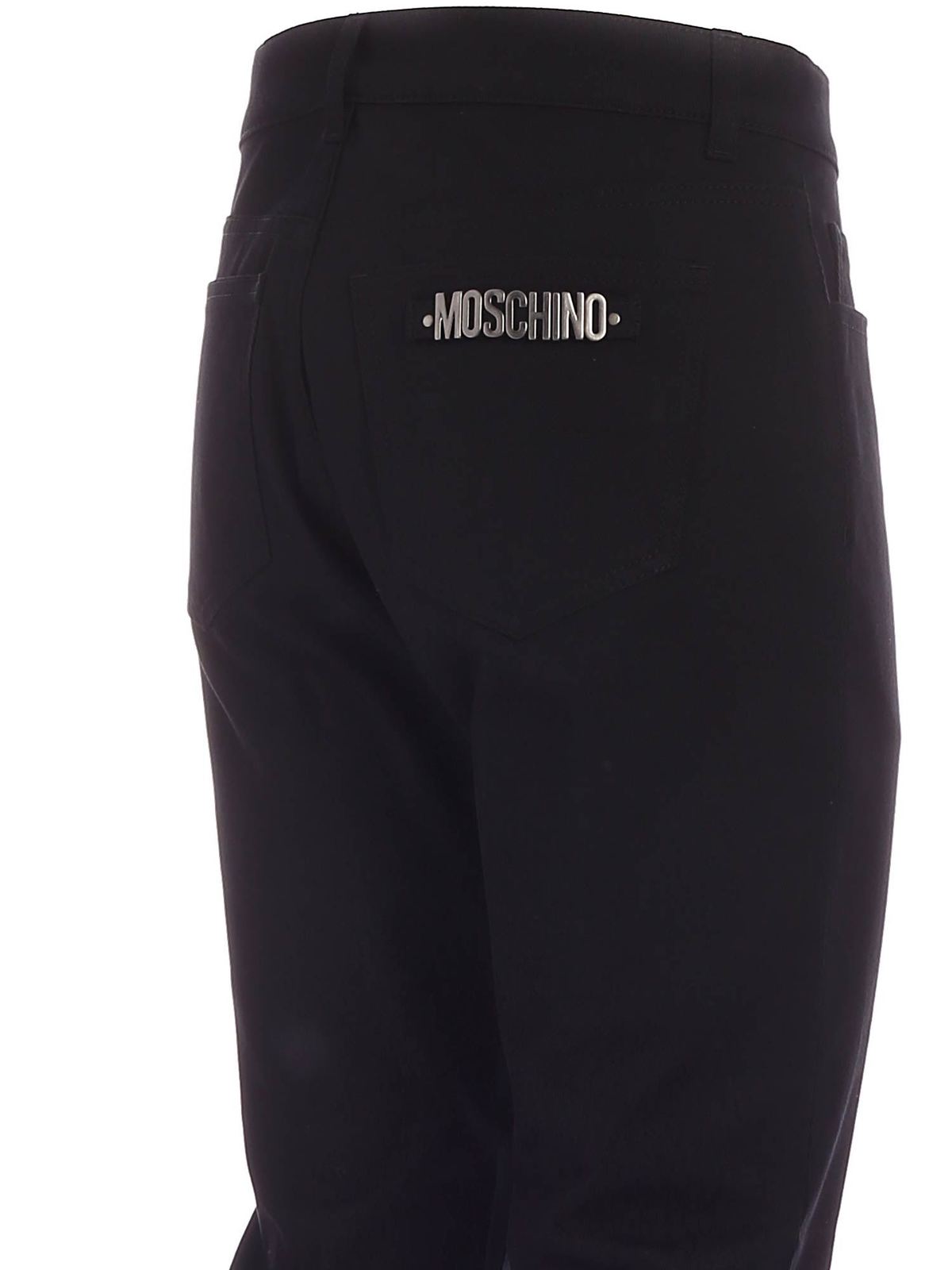 Shop Moschino Metal Logo Jeans In Black In Negro