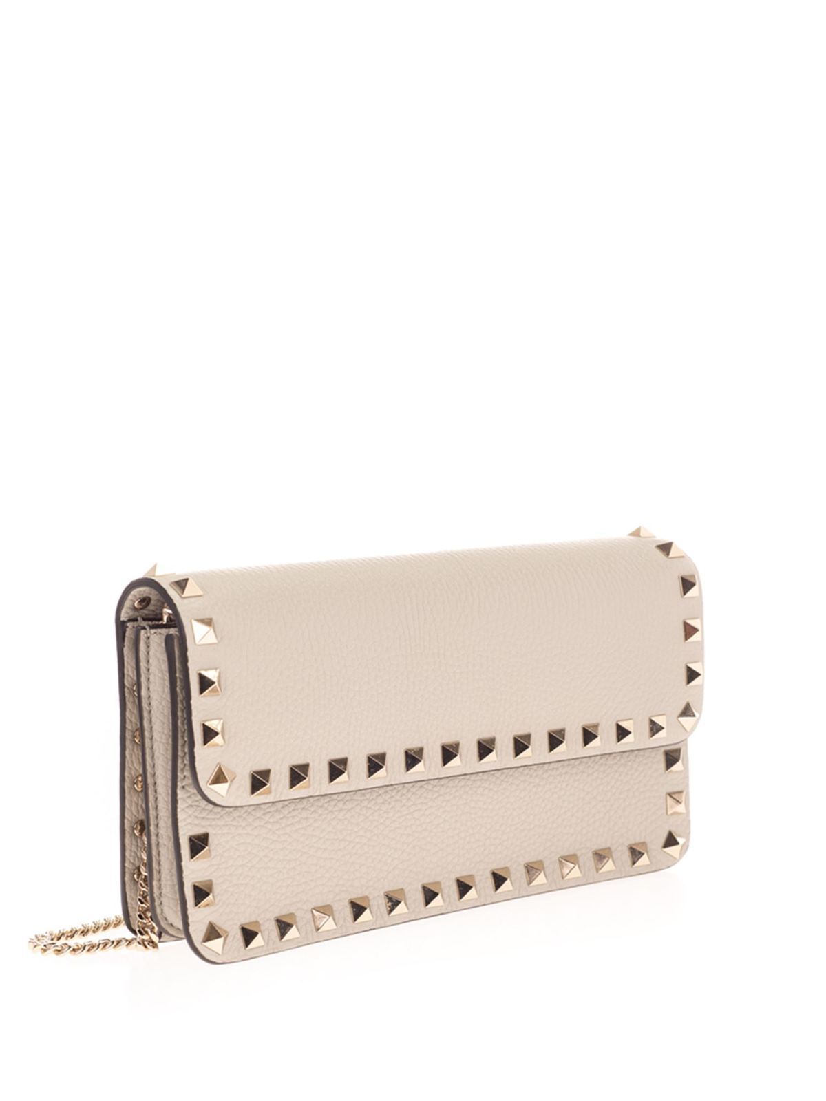 Rockstud-embellished leather clutch bag, Valentino Garavani